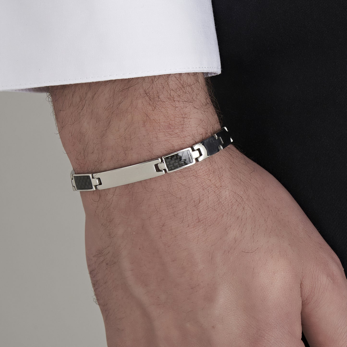 MEN'S BRACELET WITH STEEL PLATE AND BLACK ELEMENTS