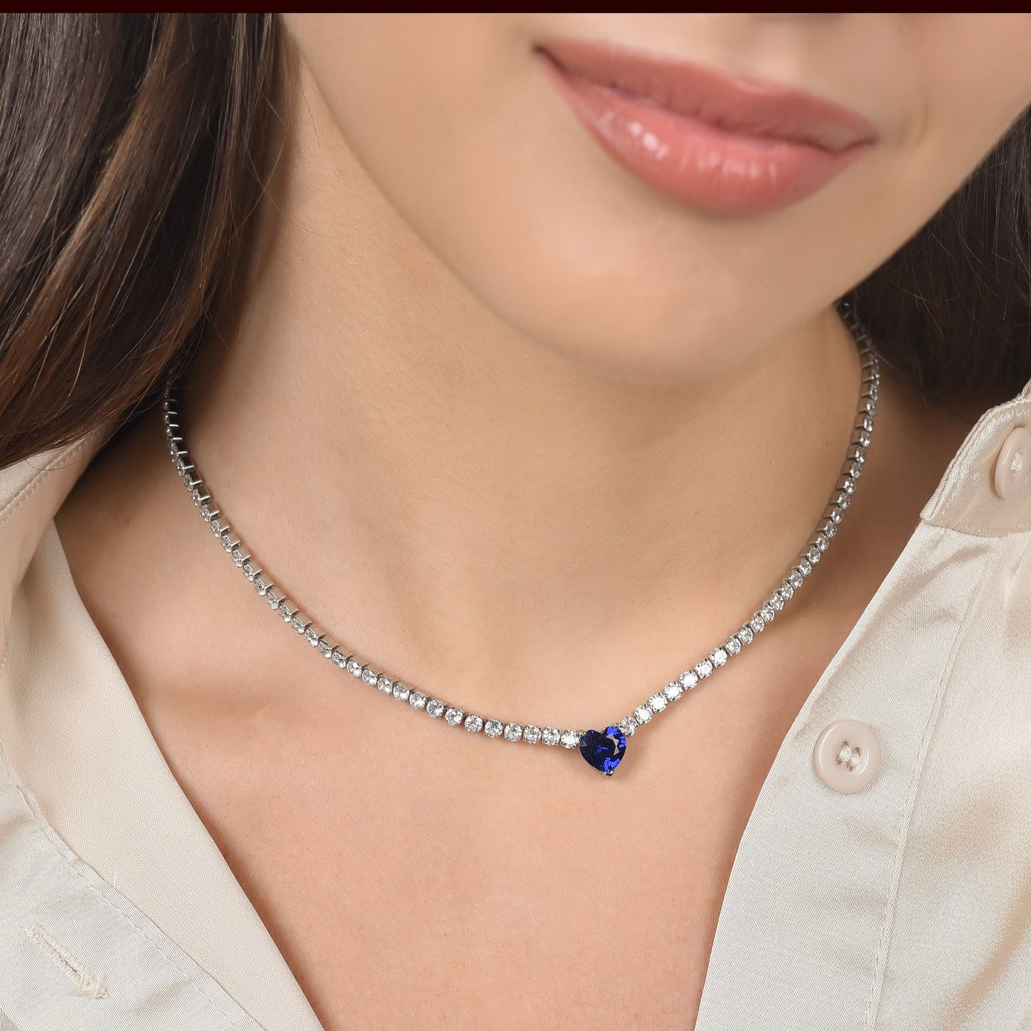 WOMEN'S STEEL TENNIS NECKLACE WITH WHITE CRYSTALS AND BLUE CRYSTAL HEART