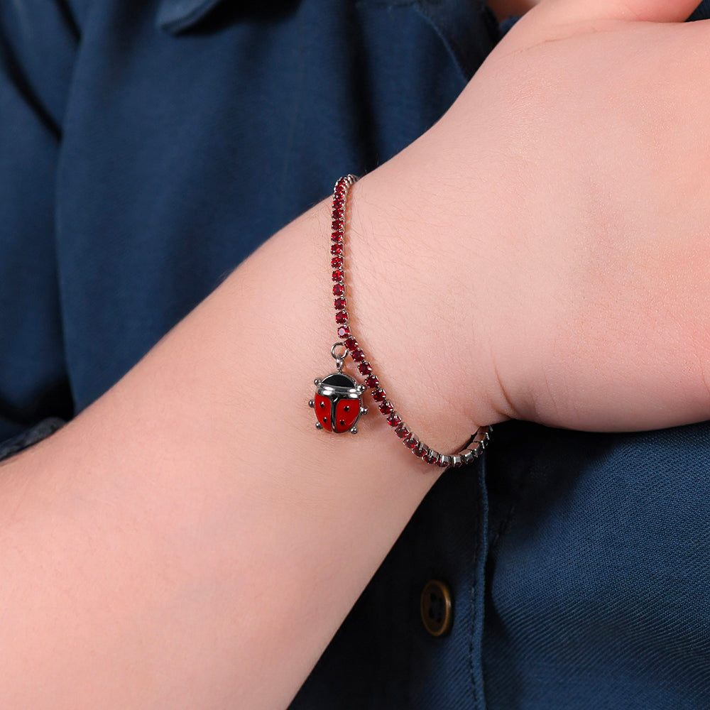 GIRL STEEL TENNIS BRACELET WITH RED CRYSTALS AND LADYBUG