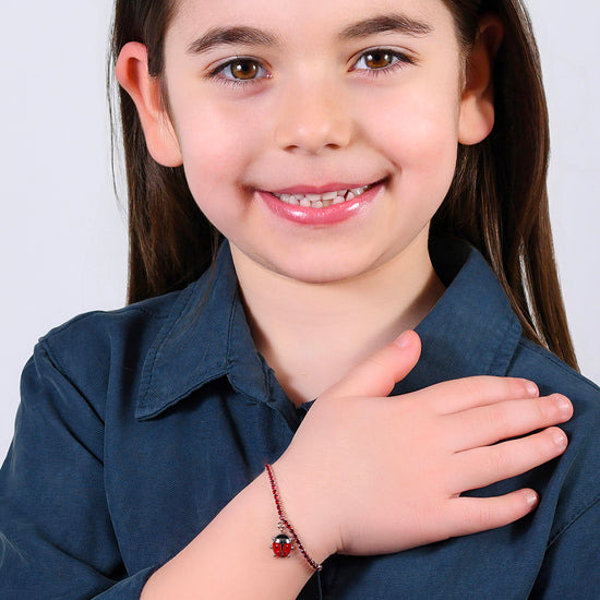 GIRL STEEL TENNIS BRACELET WITH RED CRYSTALS AND LADYBUG