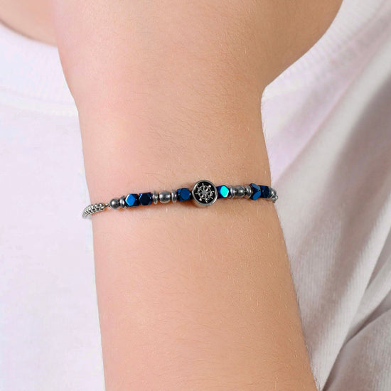 STEEL BABY BRACELET WITH BLUE HEMATITE AND RUDDER